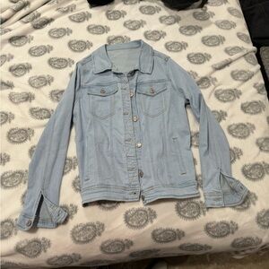 Light colored blue jean jacket. Medium size.